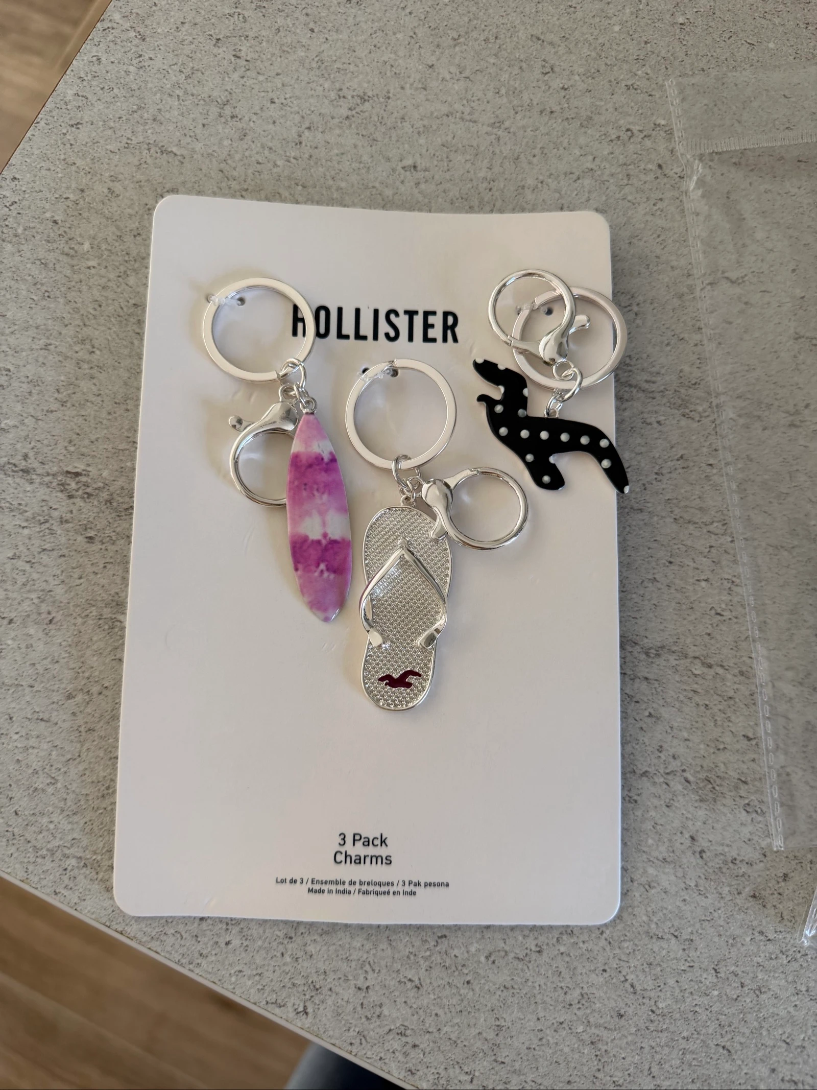 Porte clé hollister tongs planche de surf et oiseau